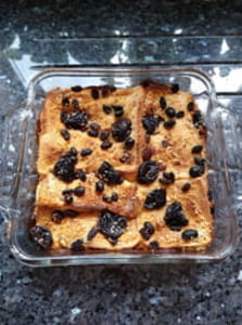 Bread and butter pudding with some topping on top